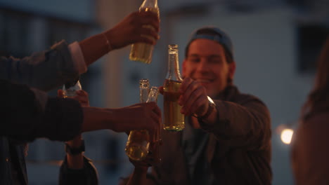 happy group of friends enjoying rooftop party celebration making toast drinking having fun sharing friendship weekend together