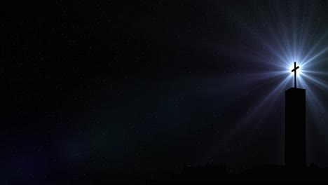 cross-silhouette-on-top-of-the-building-and-optical-flare-rays-against-the-star-background-at-night