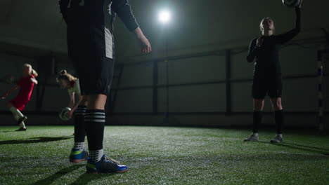 soccer players practice their skills indoors.