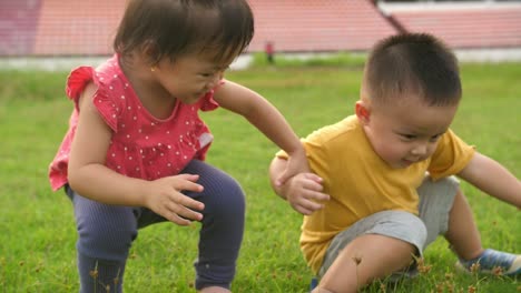 asian little boy and little girl get up