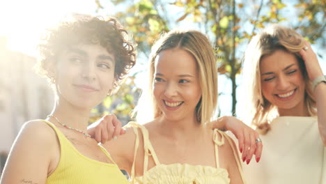 three happy young women enjoying the outdoors