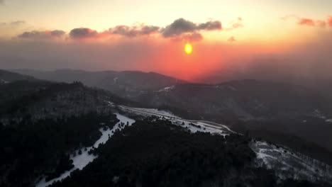 aerial push in to winter sunrise near boone nc, north carolina