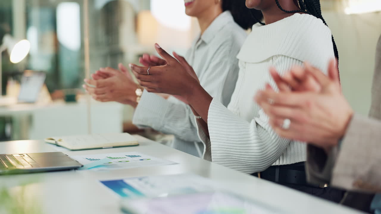 Business team applauding achievements in the office