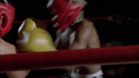 two men engage in a boxing match