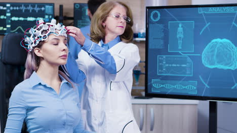 Woman-wearing-brain-waves-headset-sitting-on-a-chair