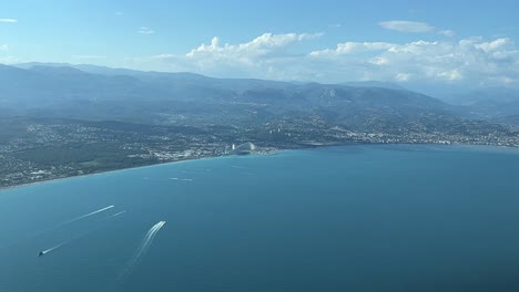 Unique-panoramic-view-of-the-French-Riviera-near-Nice-city,-recorded-from-an-airplane-cabin