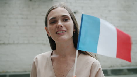 woman holding french flag