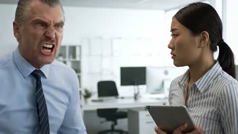 intense workplace confrontation: a boss's rage and an employee's discomfort captured in two frames of emotional turmoil and professional dread