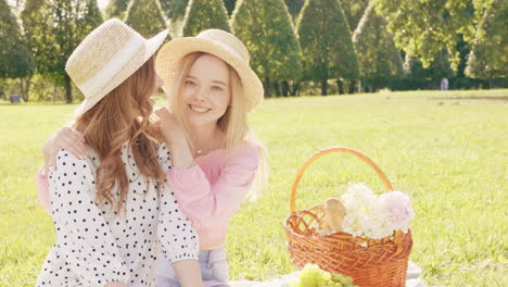 two friends enjoying a picnic in the park