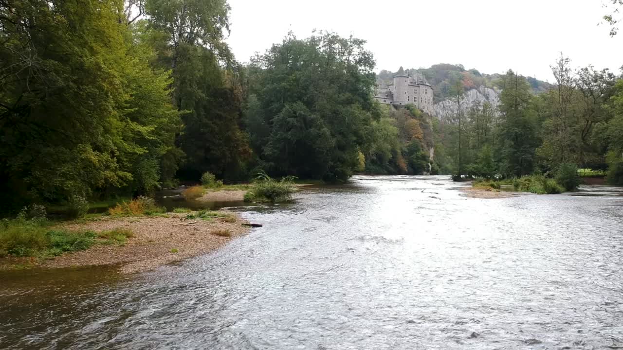 Drone flies toward historic fairytale castle Chateau De Walzin