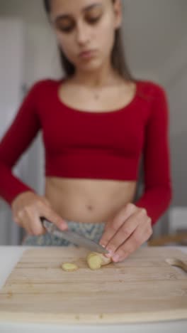woman cutting ginger