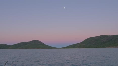 colorful horizon at burning point anchorage at shaw island during twilight hour in whitsunday, qld, australia