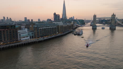 london skyline at sunset with tower bridge and river thames
