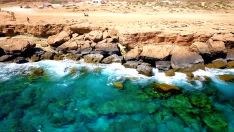 crystal clear turquoise blue water at sea caves ayia napa cyprus view