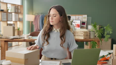 woman preparing packages in small business office
