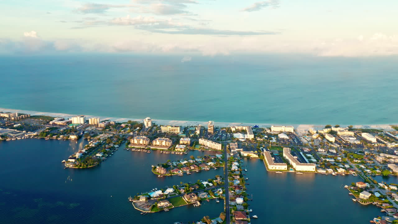4K Aerial Drone Shot over Clearwater Beach, Tampa - Florida.
Morning View over the Harbor Flying toward the Beach.