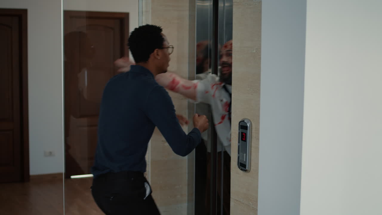 African american businessman grabbed by scary undead monsters that came out of elevator