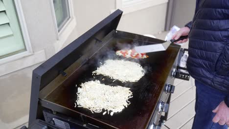 Sauteing-peppers-and-onions-to-add-to-the-hash-brown-omelets