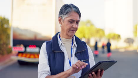 woman using tablet near truck