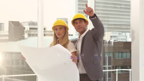 animation of caucasian male and female engineers over cityscape