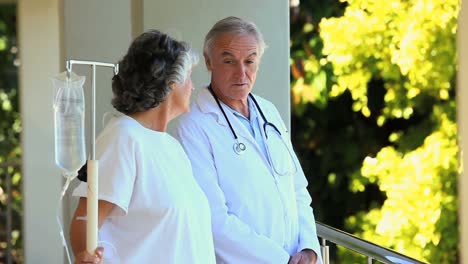 doctor and his patient walking