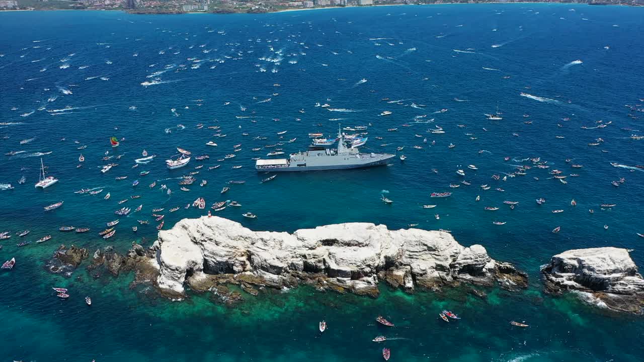 Boats in procession near Margarita Island with faith and unity in focus