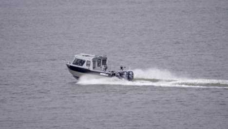 powerboat speeding across tranquil ocean. tracking shot