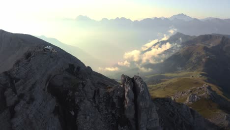 slow aerial trucking shot showing beautiful mountain landscape and valley during sunset with clouds - torre di pisa,italy