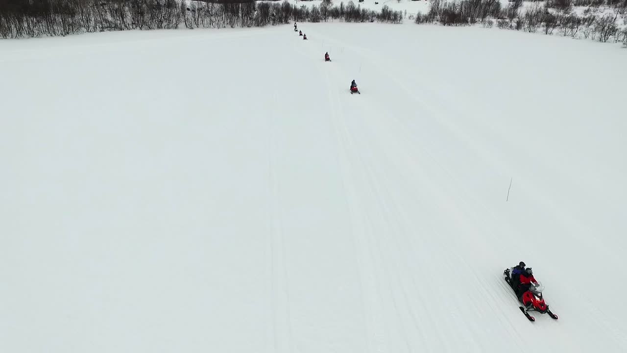 Snowmobiles on a snowy landscape