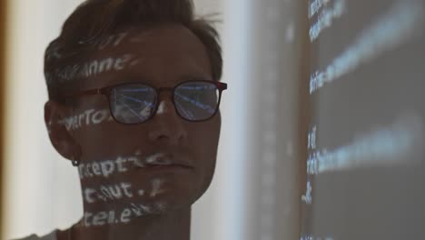 close up of programmer in eyeglasses