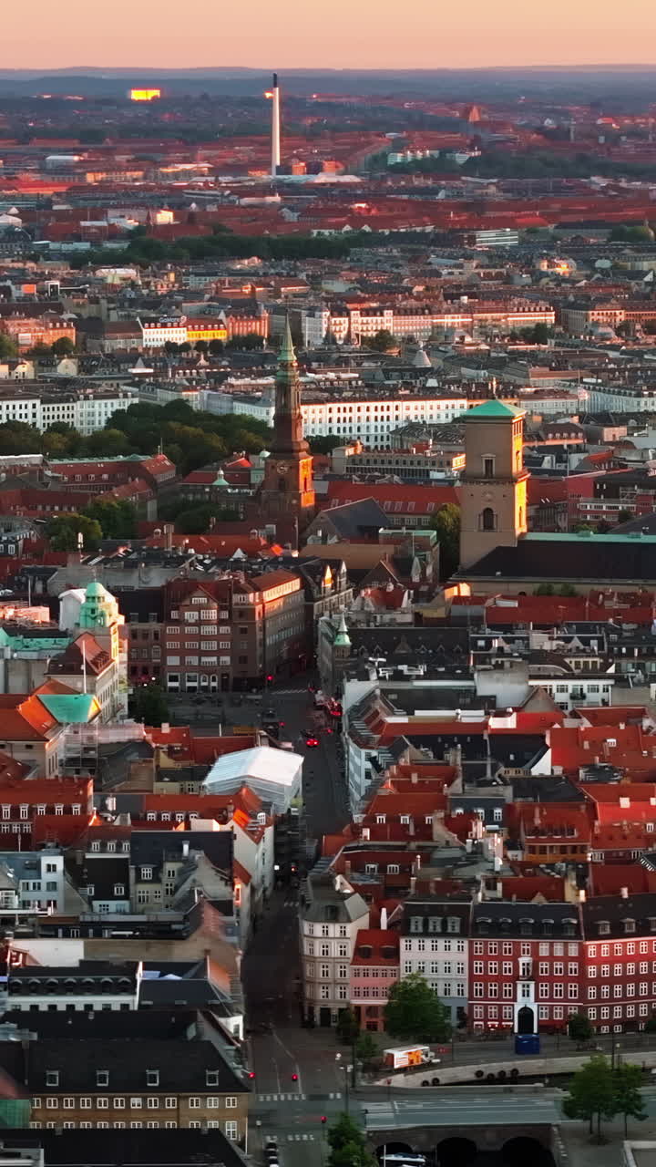 Aerial drone view of the city centre of Copenhagen, Denmark at sunset. Vertical