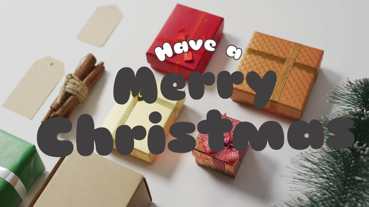 Animation of have a merry christmas text over christmas gifts and decorations on white background
