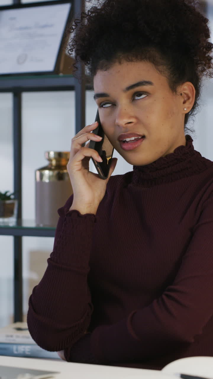 Young Woman Engaged in a Phone Call Indoors