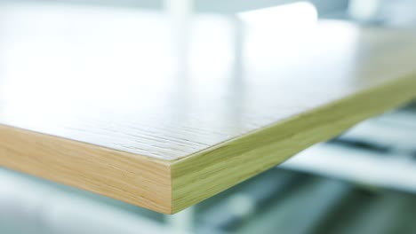 close-up of a light wood table edge