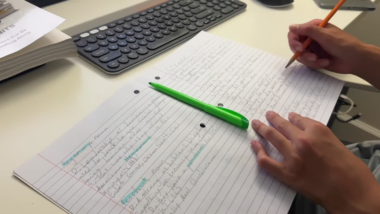 Middle School boy doing homework writing out vocabulary words for English Language Arts class
