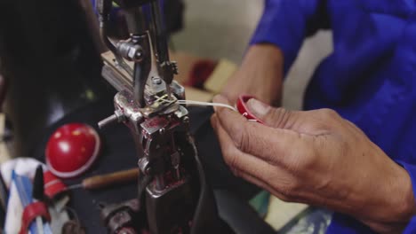 close up view mixed race man working in factory