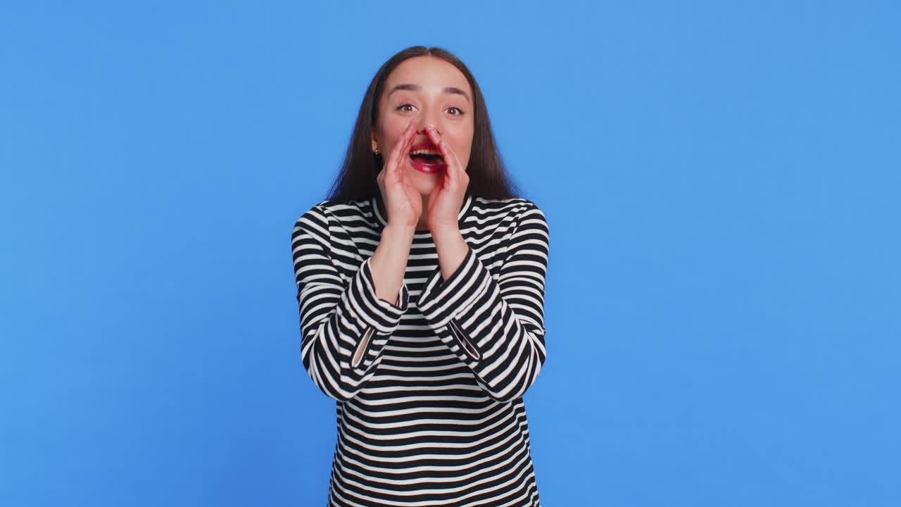 Young woman whisper news rumors holding hands near mouth share gossip quiet keep my secrets