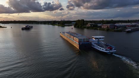 container barges navigate their way past each other