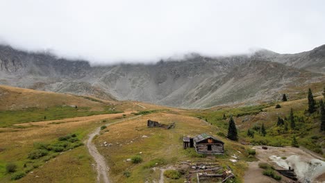 4k-Aerial-Drone-Footage-over-old-cabins-ruins-Mayflower-Gulch-Trail-in-Summit-County-near-Leadville-Copper-Mountain-Colorado