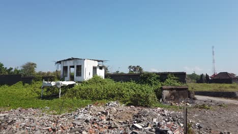 Abandoned White House Near The Beach, Devastated Building Eroded by Wind in Natural Sunny Tropical Beach Landscape with Green Mangroves, Broken Bricks