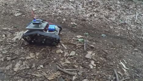 rc robot tank driving through the forest