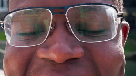 closeup, eyes and man with glasses