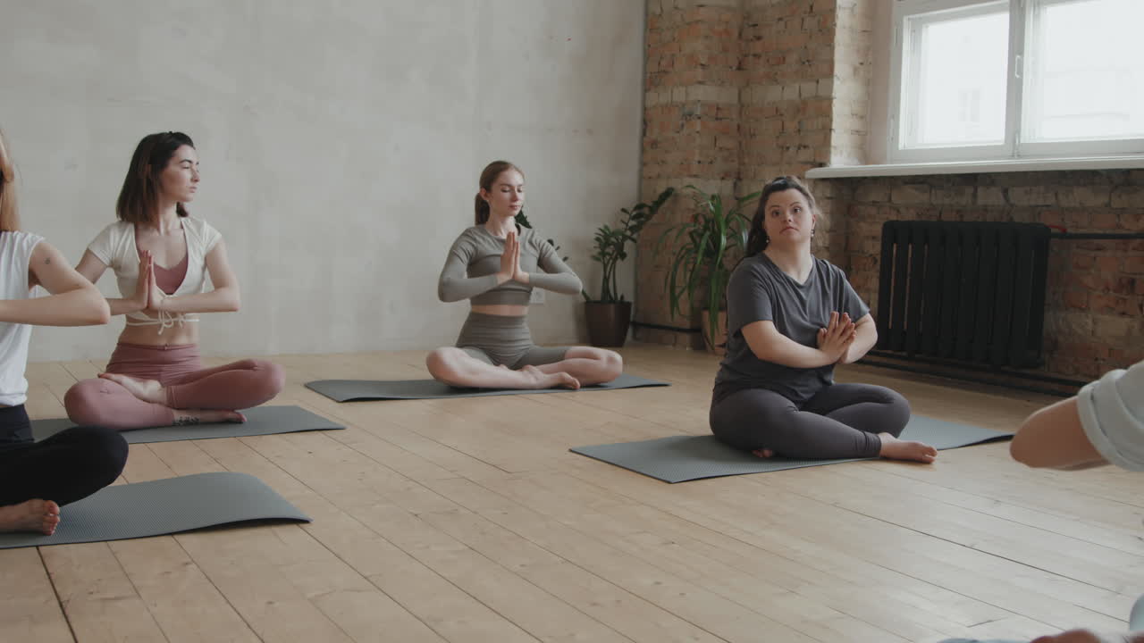 Zoom-In Of Young Woman With Down Syndrome At Yoga Class