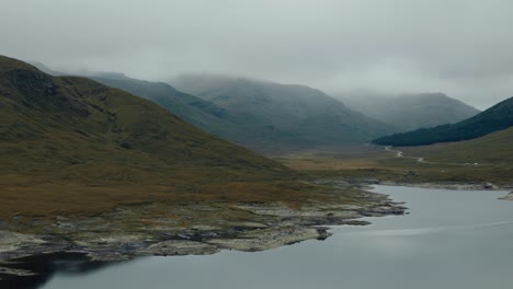 misty mountain lake in scotland