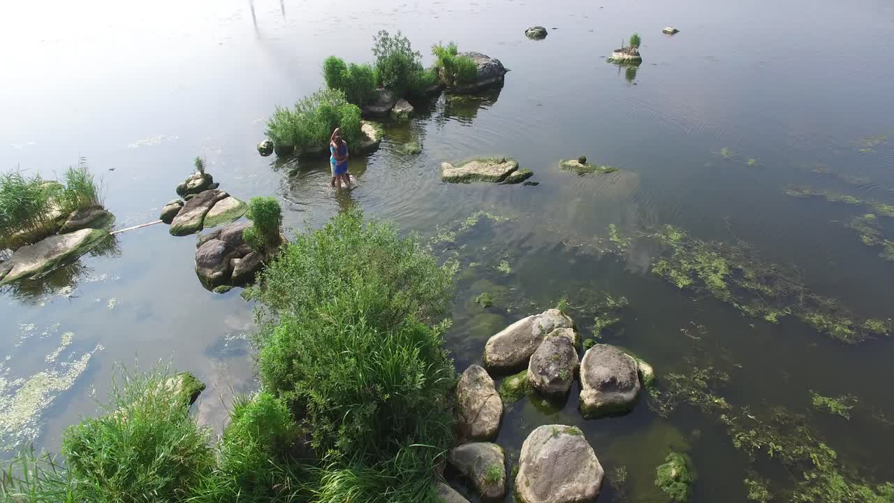 Couple Love Romance. Aerial shot of a couple love romance. Young couple in love play on the rivers beach