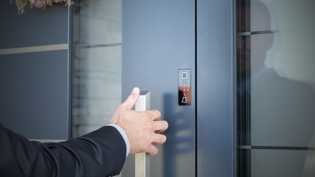 A man using biometric fingerprint sensor for open smart home door