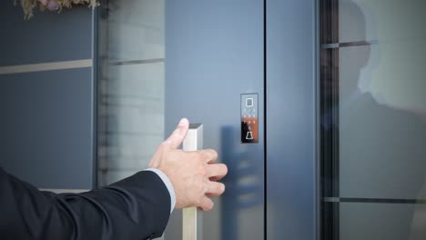 a man using biometric fingerprint sensor for open smart home door