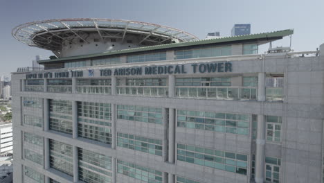 ted arison medical tower building and is helicopter landing pad on the top at the ichilov hospital center tel aviv, one of the best and most developed hospitals in israel - rising up shot