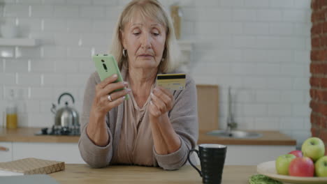 senior woman making mobile payment