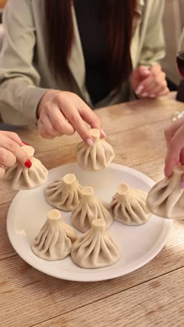 friends enjoying georgian khinkali